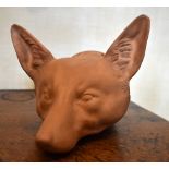 A late Victorian large terracotta fox head stirrup cup, unmarked, length 19cm. Provenance: The