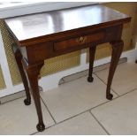 A George II style mahogany tea table of small proportions, the hinged rectangular top above frieze