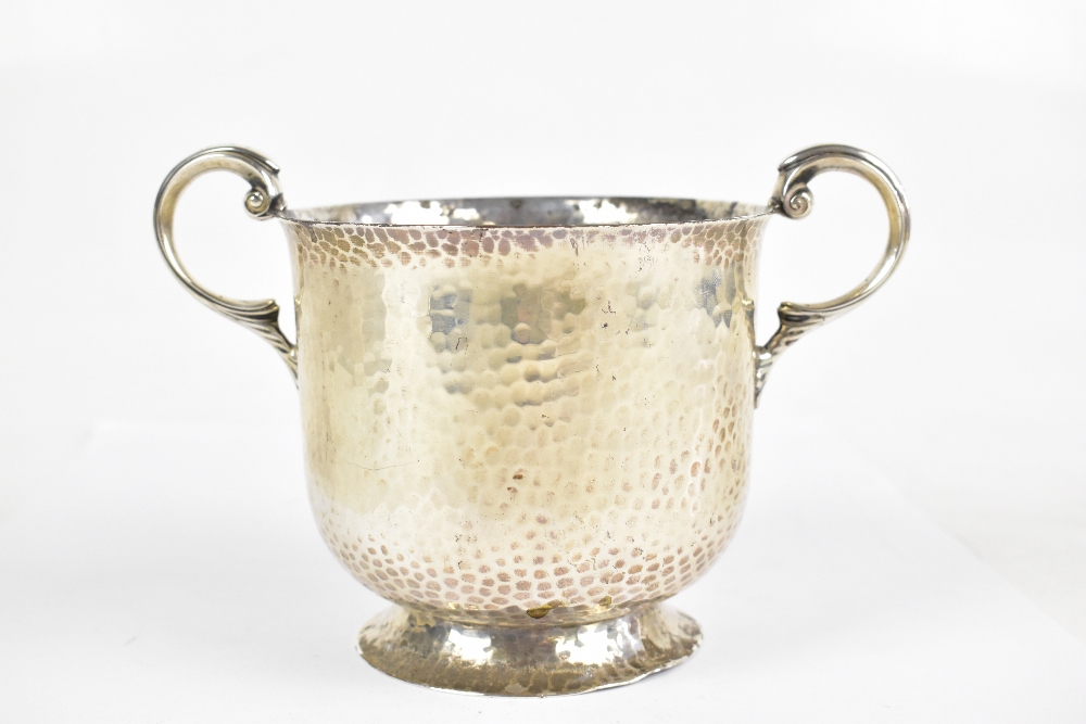 A late Victorian hallmarked beaten silver Arts & Crafts twin handled cup, with stylised central - Image 3 of 5