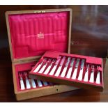 MAPPIN & WEBB; an Edwardian oak cased silver bladed and mother of pearl handled set of twelve