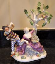 An early 19th century Meissen porcelain figure group of Harlequin and Columbine after the original