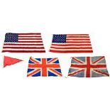 A group of four vintage flags, comprising two Union flags and two United States of America flags,