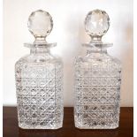 A pair of hobnail cut glass decanters with globular facet cut stoppers, height 25.5cm (2).