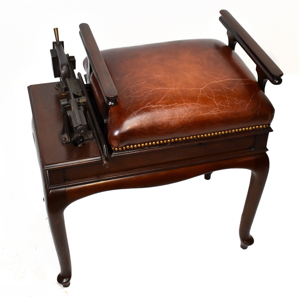 A set of Edwardian mahogany jockey or gentlemen's club scales, the brown leather stud decorated seat