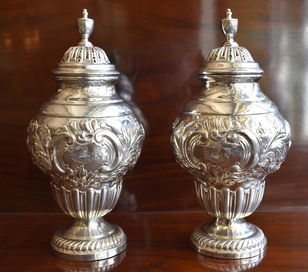 GEORGE MAUDSLEY JACKSON; a pair of late Victorian hallmarked silver sugar casters, each with band of