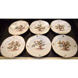 A set of six early 20th century Meissen cabinet plates, each with embossed detail to the border, set