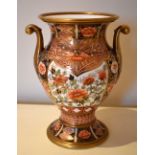 A 19th century Spode Imari decorated twin handled gilt heightened vase of baluster form, painted