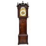 A George III mahogany longcase clock, the elaborate broken swan neck pediment with fret carved