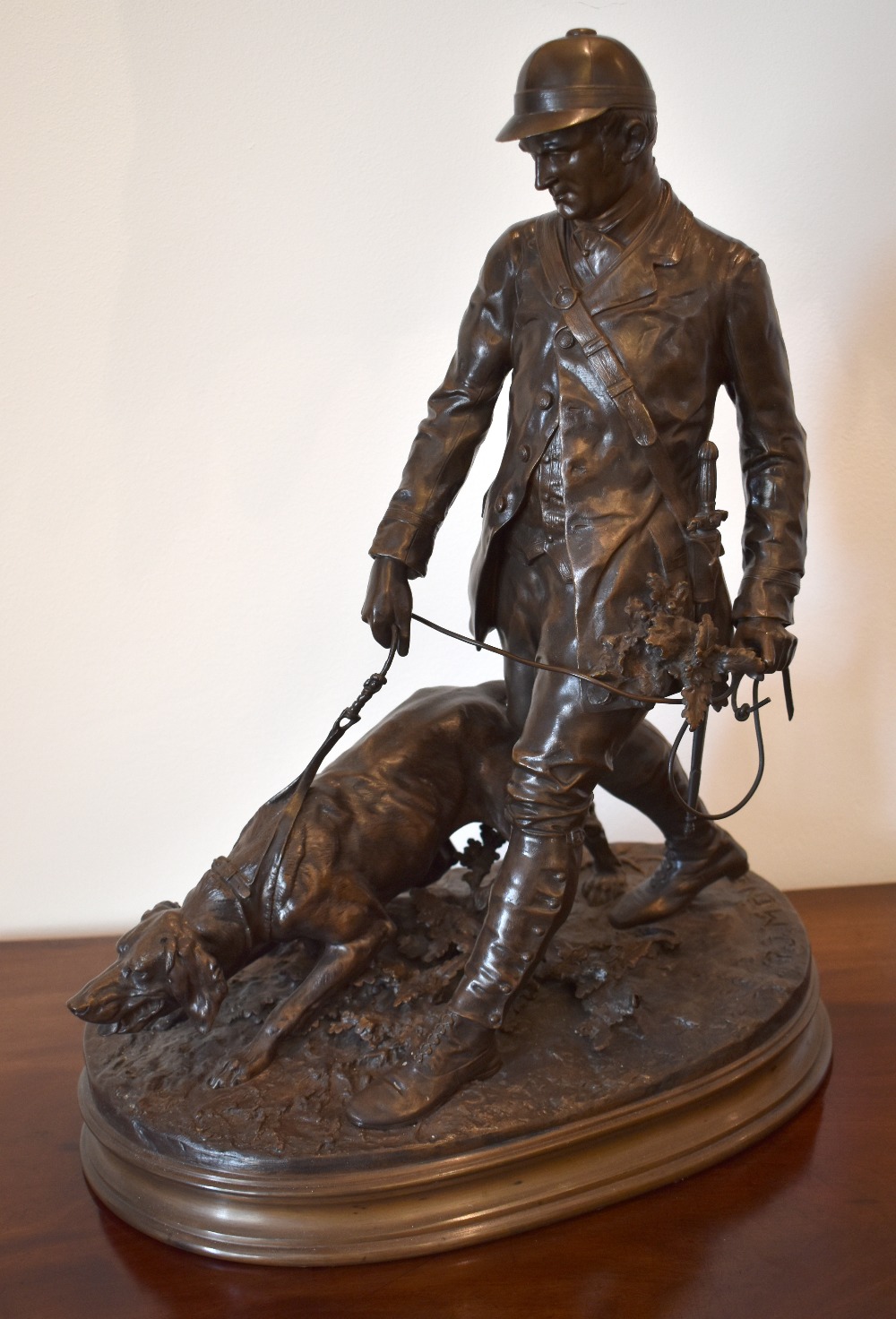 PIERRE JULES MÊNE (French, 1810-1879); a large bronze figure group of a huntsman and hound, signed