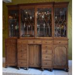 A Regency mahogany breakfront bookcase, the moulded Greek Key decorated cornice above four glazed