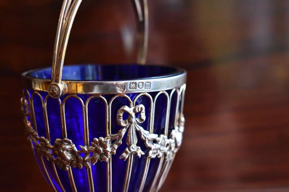 HASELER BROTHERS; an Edwardian hallmarked silver swing handled sugar bowl with blue glass liner, - Image 3 of 4