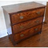 An early 19th century mahogany chest of three long drawers, raised on ogee bracket feet, height 84.