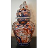 A circa 1900 Japanese Imari hexagonal vase and cover, with chi chi finial and all over floral