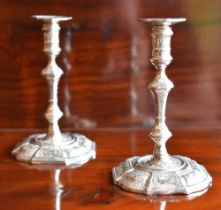 A pair of Elizabeth II hallmarked silver taper sticks in the 18th century manner, each with