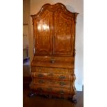 A very large late 18th century Dutch marquetry inlaid bureau bookcase, the shaped cornice above