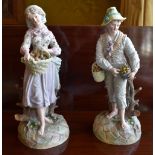 A large pair of late 19th century Continental bisque porcelain figures of a young gentleman and