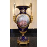 A late 19th century French porcelain ormolu mounted vase, the dark blue ground set with enamel '