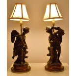 AFTER MARIN; a pair of 20th century bronze figural table lamps, each raised on bead decorated