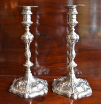 EBENEZER COKER; a pair of early George III hallmarked silver candlesticks, each with detachable