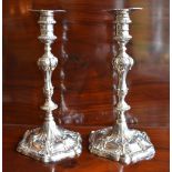 EBENEZER COKER; a pair of early George III hallmarked silver candlesticks, each with detachable