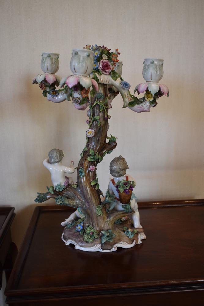 Two late 19th century German porcelain candelabra, each floral encrusted throughout with four - Image 2 of 4
