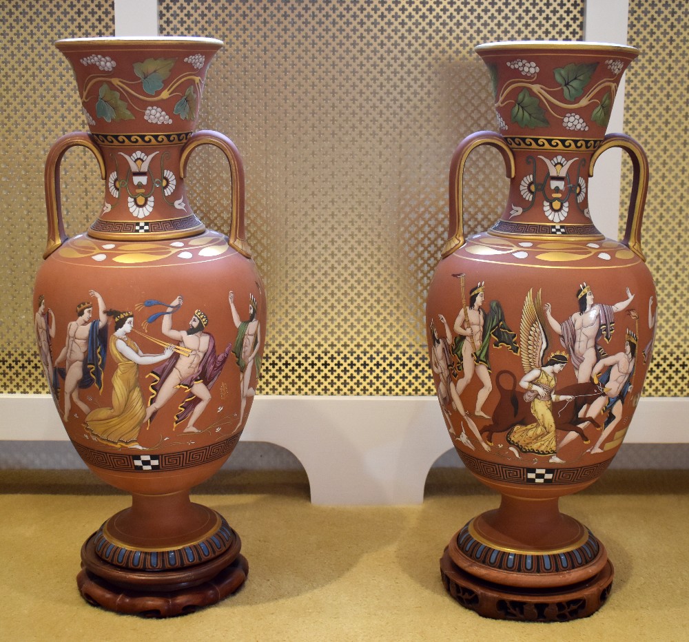 SAMUEL ALCOCK & CO; A large and unusual pair of Etruscan inspired twin handled terracotta vases, the