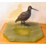 A 1930s Austrian cold painted bronze woodcock surmounted on a polish green onyx shallow dish,