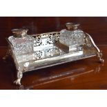 A late Victorian hallmarked silver ink standish with pierced three-quarter gallery, twin silver