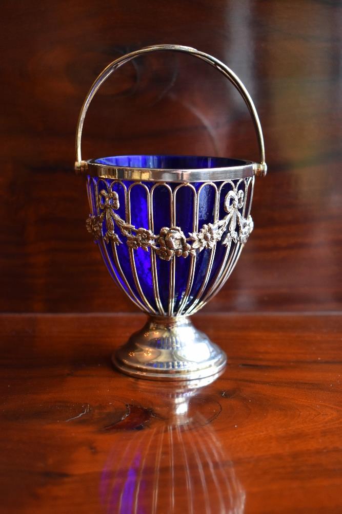 HASELER BROTHERS; an Edwardian hallmarked silver swing handled sugar bowl with blue glass liner, - Image 2 of 4