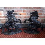 AFTER COUSTOU; a large pair of bronze Marly horses, typically modelled rearing with figure by