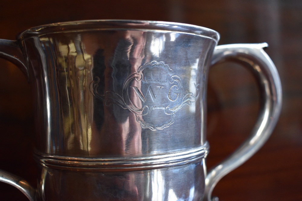 I. M.; a George III hallmarked silver twin handled cup with engraved initials 'WG' within a - Image 2 of 4