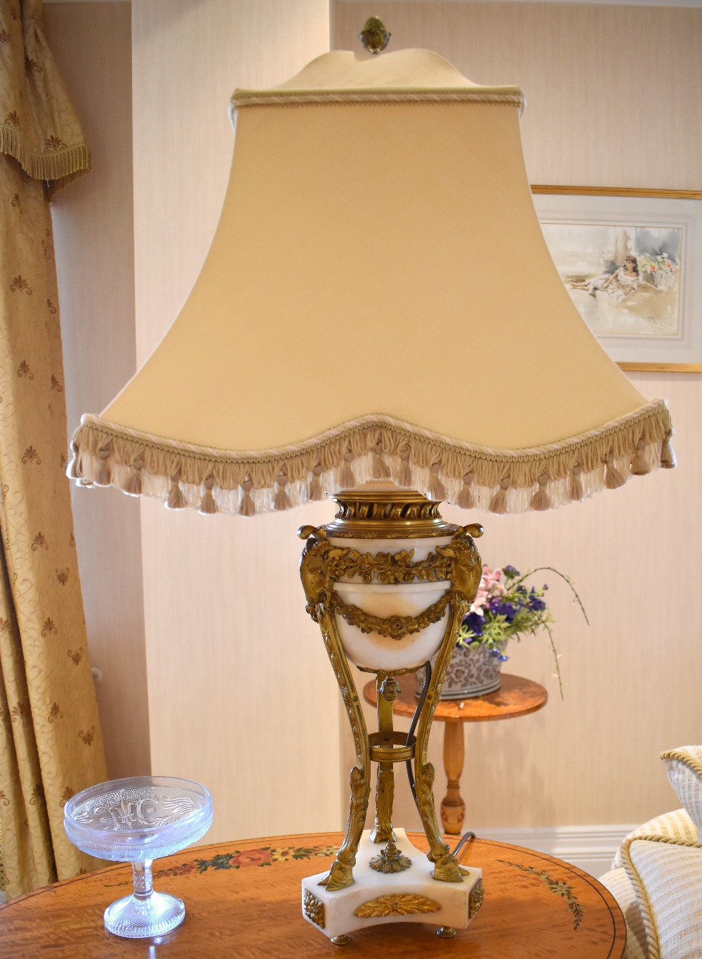 A pair of late 19th century French white marble and ormolu mounted table lamps with rams' head