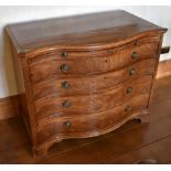 A George III mahogany serpentine chest, the chevron strung crossbanded shaped moulded top above