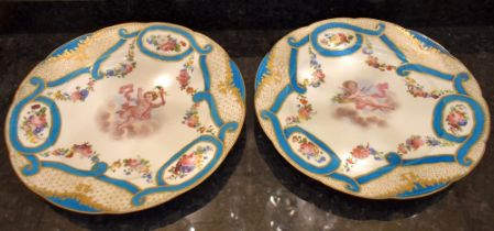 A pair of 19th century Sèvres cabinet plates with bleu celeste and gilt heightened border, floral