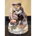 A late 19th century Meissen porcelain figure group of male and female gardeners with a boy by