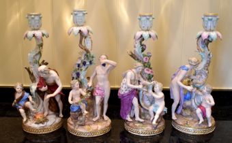 A set of four late 19th century Meissen candlesticks representing the four Seasons, each with