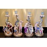 A set of four late 19th century Meissen candlesticks representing the four Seasons, each with