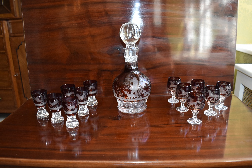 An early 20th century cut glass ruby tinted liqueur set comprising a decanter with substantial - Bild 2 aus 4