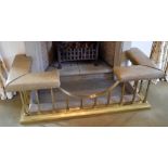 A brass and leather stud upholstered club fender, width 147cm, depth 65cm. Provenance: The