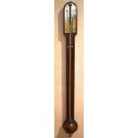 A George III mahogany stick barometer, the scale signed 'A. E. Abraham, Optician, Exeter', with