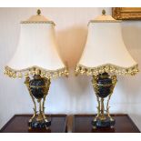 A pair of late 19th century French green marble and ormolu mounted table lamps, each with Bacchus