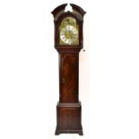 A George III mahogany longcase clock, the arched pediment above arched brass dial, inscribed