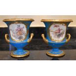 A pair of late 18th century miniature Sèvres porcelain campana urns with gilt metal rim and foot,