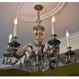 A silver plated six branch electrolier with wrythen baluster twisted central column supporting the