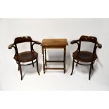 A pair of early 20th century oak bentwood captains' chairs, curved back rail to outswept arms,