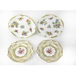 HEREND; a pair of cabinet plates, decorated with flowers and butterflies, diameter 26cm,