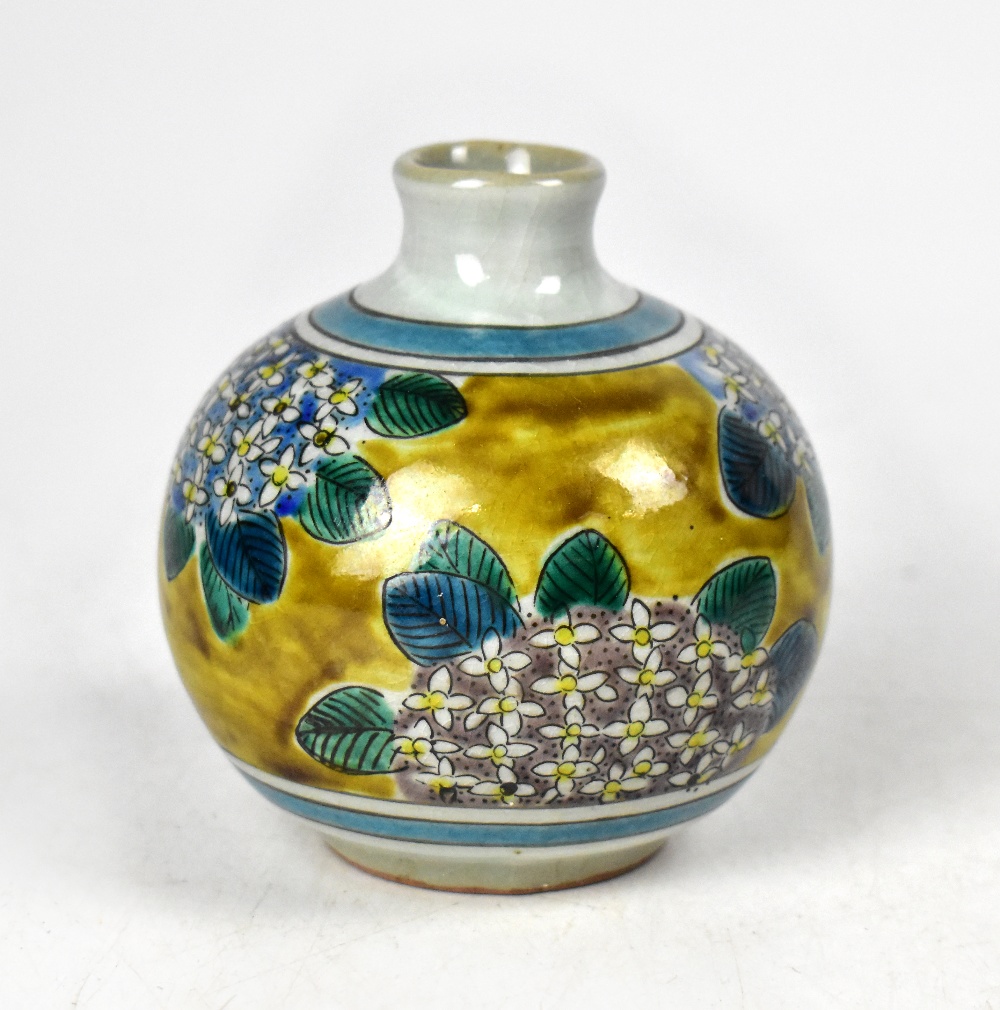 A squat baluster vase in the Oriental style,