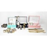 A quantity of costume jewellery and watches to include a cased champagne-coloured diamanté necklace,