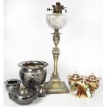 A Victorian plated oil lamp, the base in the form of a Neo-Classical column with urn,