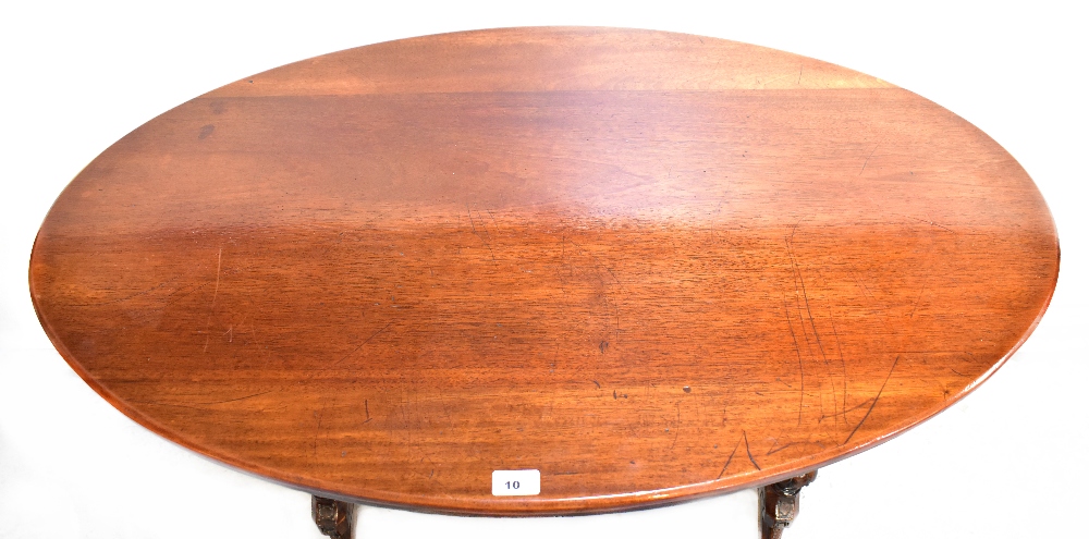 A 19th century mahogany oval top centre table with turned side columns and turned stretcher, - Image 2 of 2